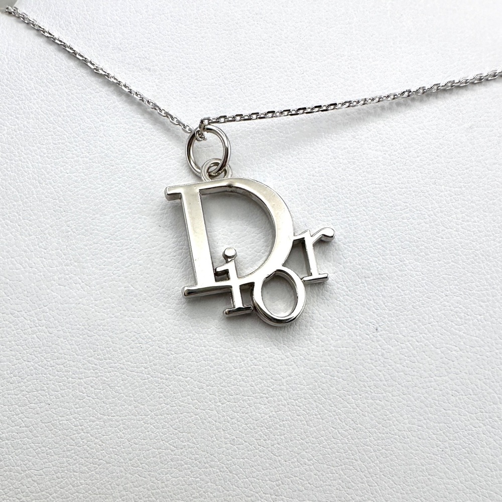 Dior charm necklace. With 18 inch sterling silver chain.